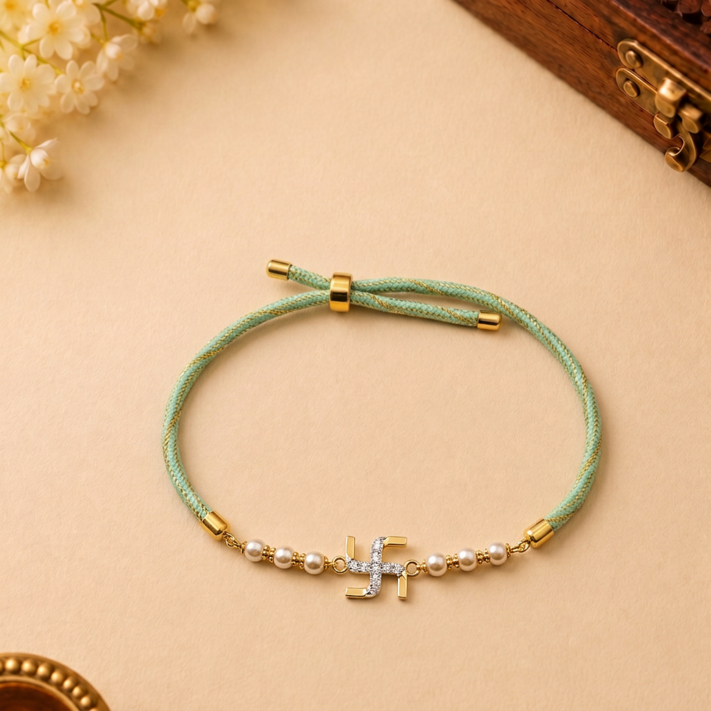 Swastik Gold Plated Silver Rakhi