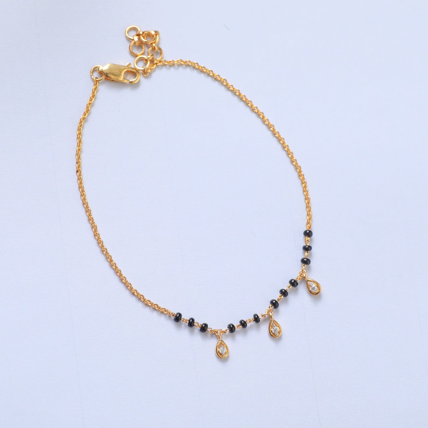 Three CZ Tear Drops Silver Black Bead Bracelet