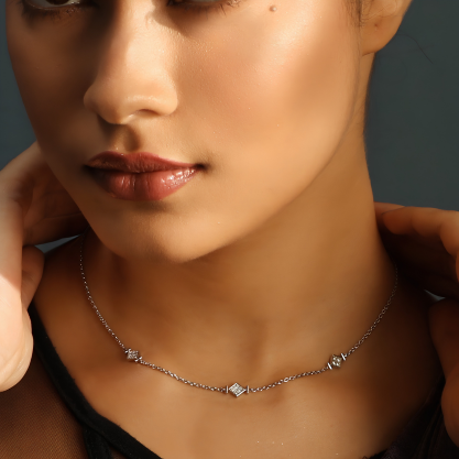 925 sterling silver delicate necklace with geometric charms worn by a woman
