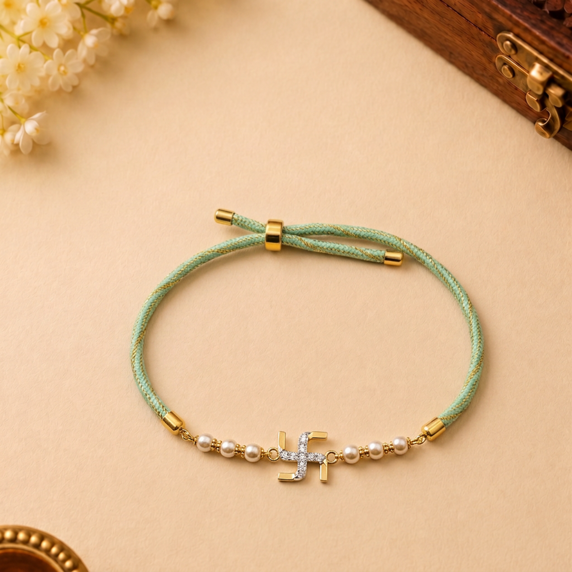 Swastik Gold Plated Silver Rakhi