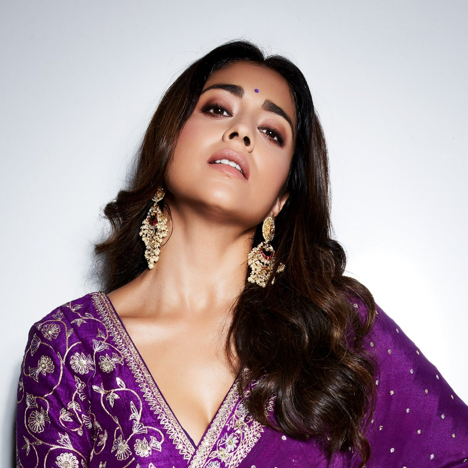 Free Photos - A Stunning Indian Woman, Adorned With Elegant Gold Jewelry,  Including A Necklace And Earrings, And Wearing A Luxurious Purple Saree.  Her Outfit Is Complemented By A Well-matched Bindi And